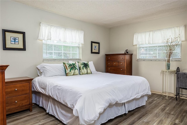 521 Lone Palm Dr, Lakeland, FL 33815 - bedroom featuring wood finished floors and a textured ceiling
