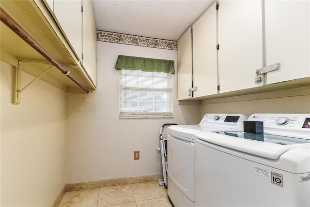 521 Lone Palm Dr, Lakeland, FL 33815 - laundry room featuring washer and dryer, light tile patterned flooring, a textured ceiling, and cabinet space