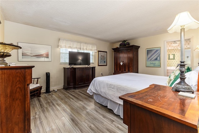 521 Lone Palm Dr, Lakeland, FL 33815 - bedroom featuring wood finished floors and a textured ceiling