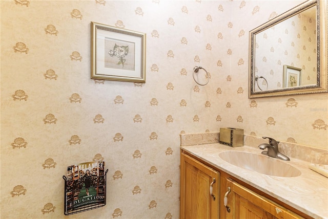521 Lone Palm Dr, Lakeland, FL 33815 - bathroom featuring vanity and wallpapered walls