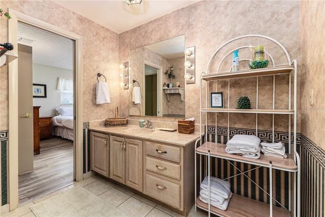 521 Lone Palm Dr, Lakeland, FL 33815 - bathroom featuring vanity, ensuite bath, and tile patterned flooring