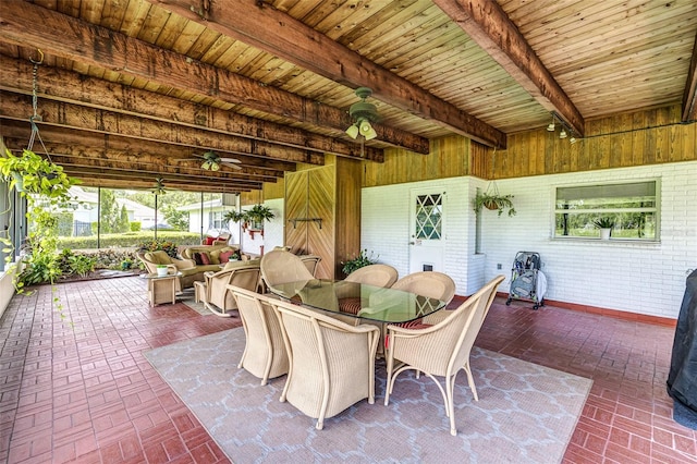 521 Lone Palm Dr, Lakeland, FL 33815 - sunroom featuring a ceiling fan, beam ceiling, and outdoor dining space