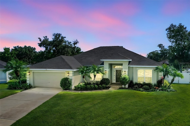 122 Amber Blvd, Auburndale, FL 33823 - single story home featuring stucco siding, a garage, driveway, and a shingled roof