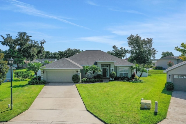 122 Amber Blvd, Auburndale, FL 33823 - ranch-style home featuring a garage, a front lawn, driveway, and stucco siding