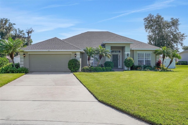 122 Amber Blvd, Auburndale, FL 33823 - single story home with stucco siding, an attached garage, a front lawn, and concrete driveway