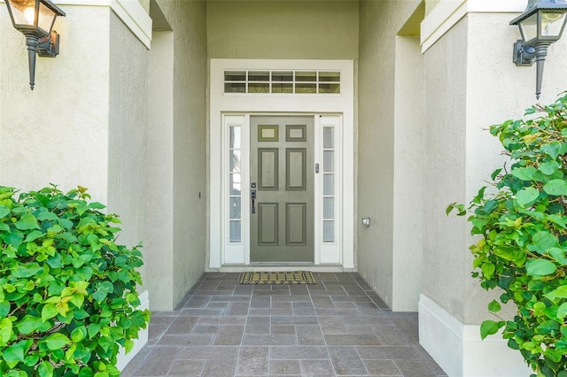 122 Amber Blvd, Auburndale, FL 33823 - property entrance with stucco siding