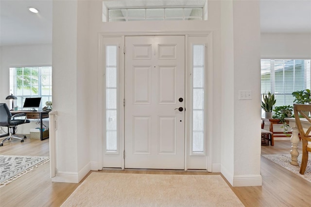 122 Amber Blvd, Auburndale, FL 33823 - entrance foyer featuring light wood-type flooring and recessed lighting
