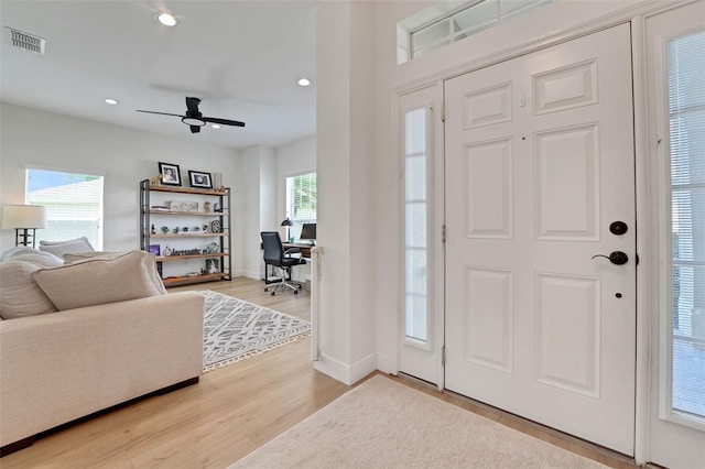 122 Amber Blvd, Auburndale, FL 33823 - foyer entrance featuring a ceiling fan, wood finished floors, and recessed lighting