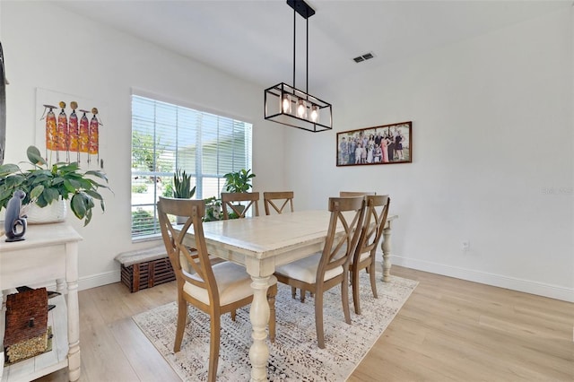 122 Amber Blvd, Auburndale, FL 33823 - dining room featuring light wood-type flooring and a chandelier