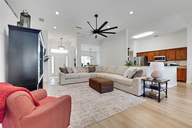 122 Amber Blvd, Auburndale, FL 33823 - living room with light wood-style flooring, recessed lighting, and ceiling fan