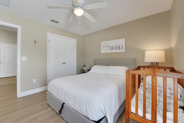 122 Amber Blvd, Auburndale, FL 33823 - bedroom with light wood-type flooring, ceiling fan, and a closet