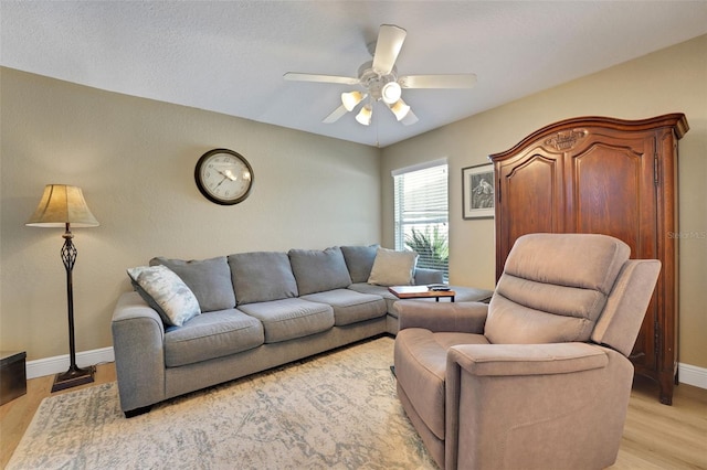 122 Amber Blvd, Auburndale, FL 33823 - living area featuring a ceiling fan and light wood-type flooring