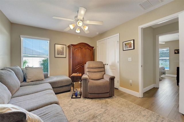 122 Amber Blvd, Auburndale, FL 33823 - living area with ceiling fan and light wood-style floors
