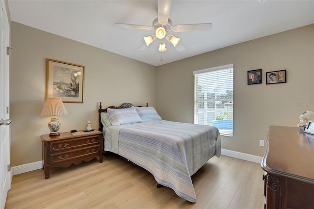 122 Amber Blvd, Auburndale, FL 33823 - bedroom with light wood-style floors and a ceiling fan