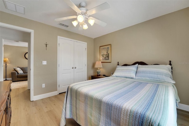 122 Amber Blvd, Auburndale, FL 33823 - bedroom featuring light wood-type flooring, a closet, and a ceiling fan