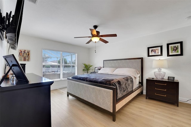 122 Amber Blvd, Auburndale, FL 33823 - bedroom featuring light wood-style floors and a ceiling fan