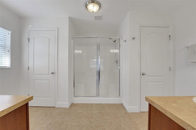 122 Amber Blvd, Auburndale, FL 33823 - bathroom with vanity, a stall shower, and tile patterned flooring