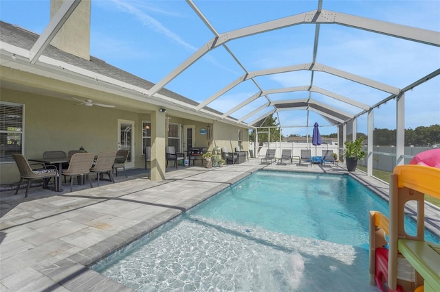 122 Amber Blvd, Auburndale, FL 33823 - view of pool featuring a patio, a ceiling fan, outdoor dining space, and a lanai