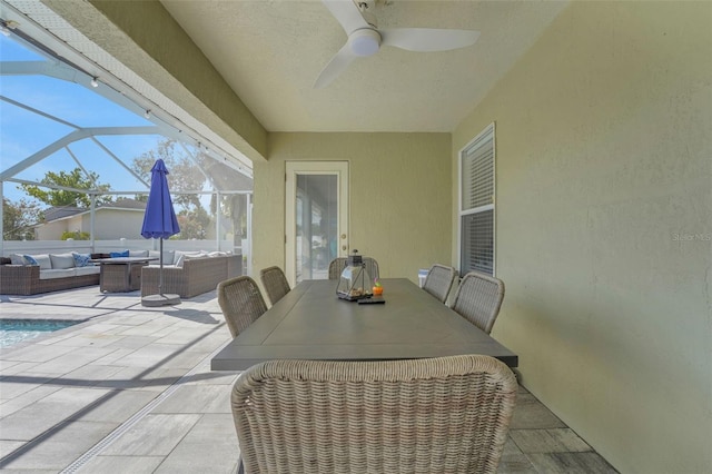 122 Amber Blvd, Auburndale, FL 33823 - view of patio / terrace with an outdoor hangout area, ceiling fan, glass enclosure, and outdoor dining space
