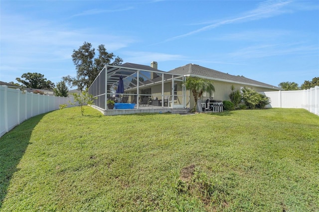 122 Amber Blvd, Auburndale, FL 33823 - back of property with a fenced backyard and a lanai