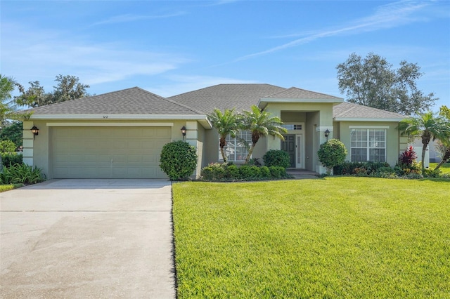 122 Amber Blvd, Auburndale, FL 33823 - view of front of house with stucco siding, an attached garage, a front lawn, and concrete driveway