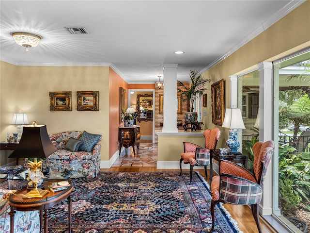 2213 Woodbine Ave, Lakeland, FL 33803 - living room featuring ornate columns, wood finished floors, ornamental molding, and recessed lighting