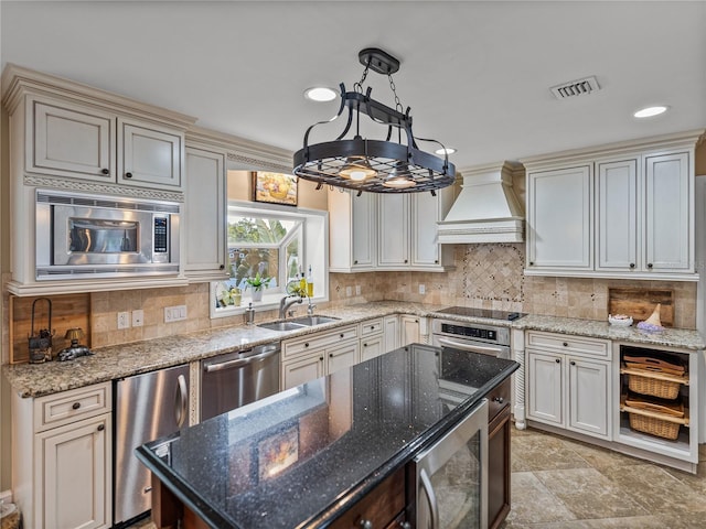 2213 Woodbine Ave, Lakeland, FL 33803 - kitchen featuring custom exhaust hood, stainless steel appliances, backsplash, recessed lighting, and stone countertops