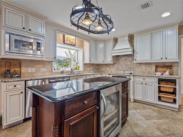 2213 Woodbine Ave, Lakeland, FL 33803 - kitchen with premium range hood, wine cooler, stainless steel appliances, tasteful backsplash, and recessed lighting