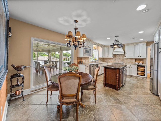 2213 Woodbine Ave, Lakeland, FL 33803 - dining room featuring a chandelier and recessed lighting
