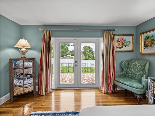 2213 Woodbine Ave, Lakeland, FL 33803 - doorway to outside with french doors and wood finished floors