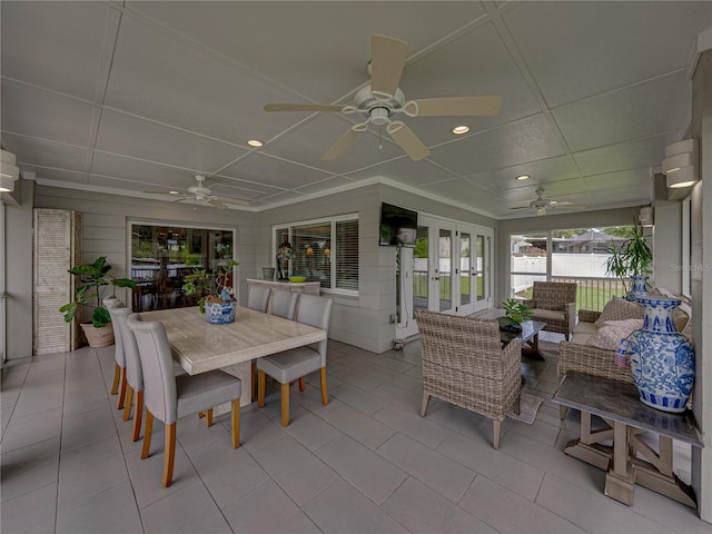 2213 Woodbine Ave, Lakeland, FL 33803 - sunroom with ceiling fan, french doors, and outdoor dining space