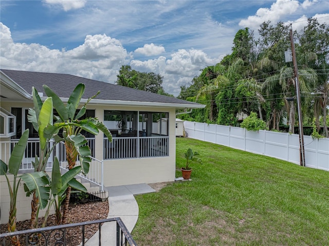 2213 Woodbine Ave, Lakeland, FL 33803 - fenced backyard with a sunroom