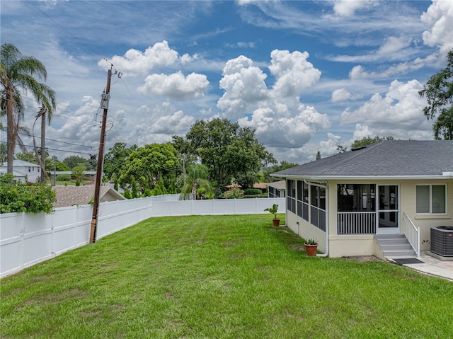 2213 Woodbine Ave, Lakeland, FL 33803 - fenced backyard with a sunroom