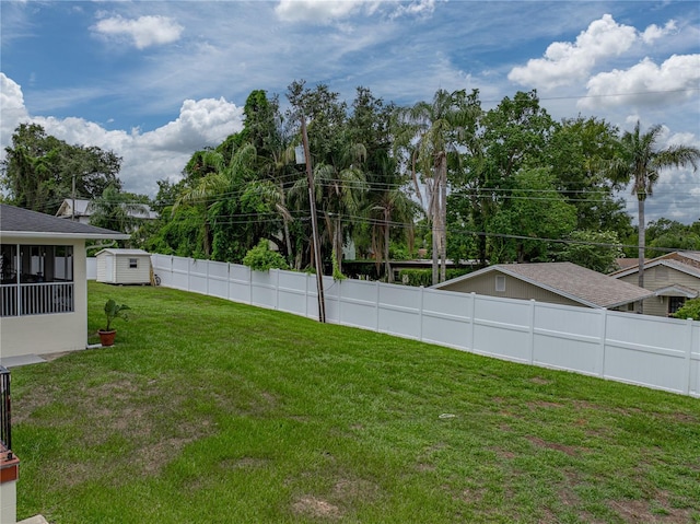 2213 Woodbine Ave, Lakeland, FL 33803 - fenced backyard featuring a storage unit