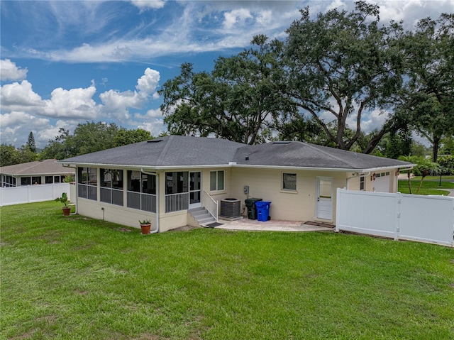 2213 Woodbine Ave, Lakeland, FL 33803 - back of house featuring a sunroom, a gate, a patio area, and a garage
