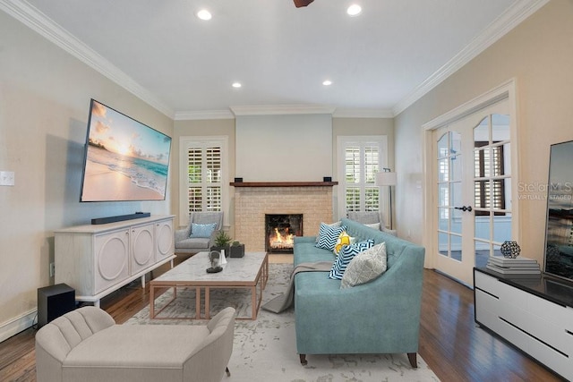 207 W Maxwell St, Lakeland, FL 33803 - living area with wood finished floors, a fireplace, ornamental molding, and recessed lighting