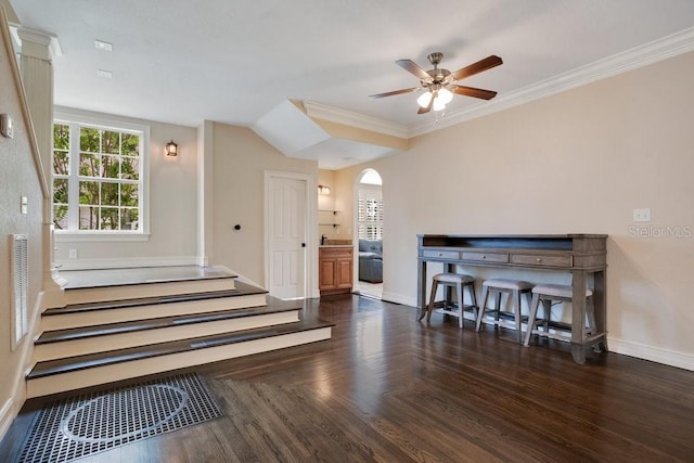 207 W Maxwell St, Lakeland, FL 33803 - stairway featuring arched walkways, ceiling fan, wood finished floors, and crown molding
