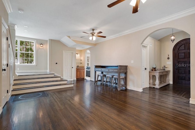 207 W Maxwell St, Lakeland, FL 33803 - foyer featuring arched walkways, ceiling fan, wood finished floors, and crown molding