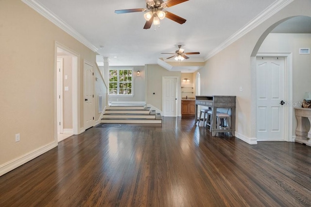 207 W Maxwell St, Lakeland, FL 33803 - unfurnished living room featuring a ceiling fan, wood finished floors, arched walkways, stairway, and ornamental molding