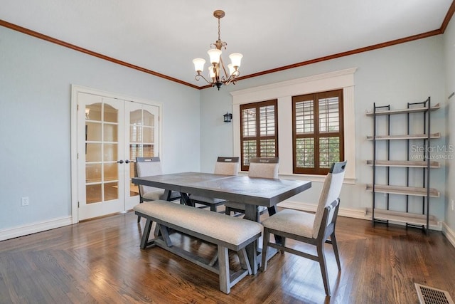207 W Maxwell St, Lakeland, FL 33803 - dining room with french doors, a chandelier, ornamental molding, and wood finished floors