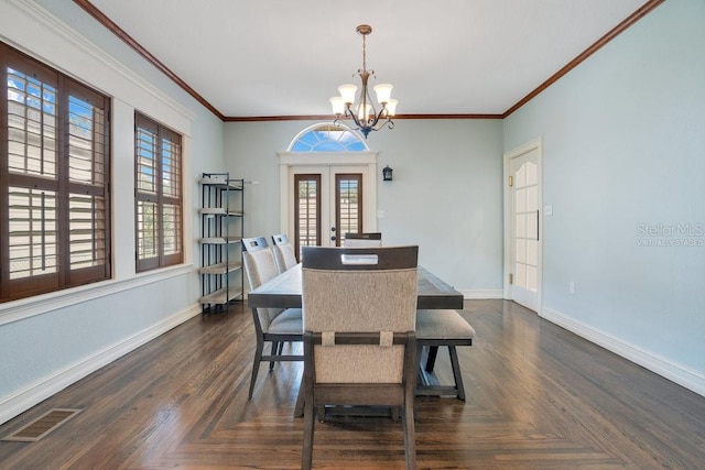 207 W Maxwell St, Lakeland, FL 33803 - dining space featuring a chandelier and crown molding