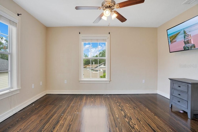 207 W Maxwell St, Lakeland, FL 33803 - spare room with healthy amount of natural light, dark wood finished floors, and ceiling fan