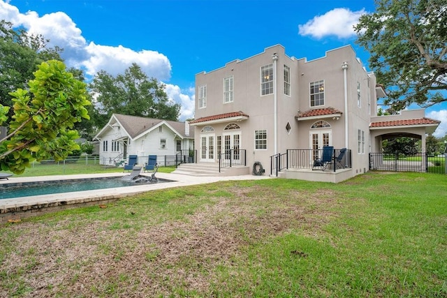 207 W Maxwell St, Lakeland, FL 33803 - rear view of property featuring french doors, stucco siding, a patio, and a tiled roof