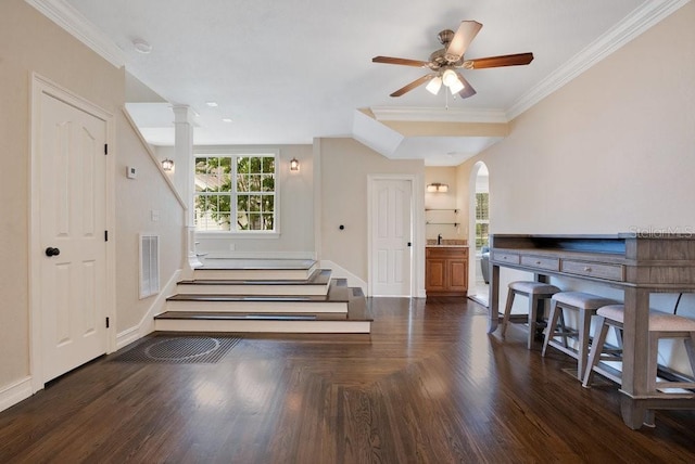 207 W Maxwell St, Lakeland, FL 33803 - entrance foyer with ornamental molding, stairway, ceiling fan, wood finished floors, and arched walkways