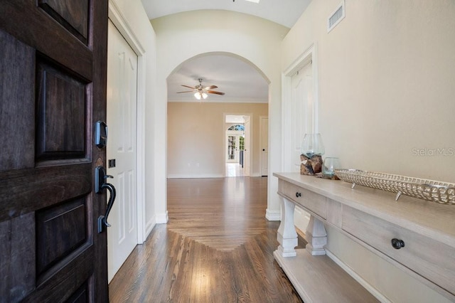 207 W Maxwell St, Lakeland, FL 33803 - foyer entrance with a ceiling fan, ornamental molding, arched walkways, and dark wood finished floors
