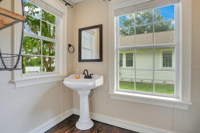 207 W Maxwell St, Lakeland, FL 33803 - bathroom featuring baseboards and wood finished floors