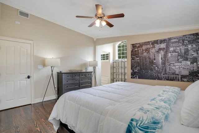 207 W Maxwell St, Lakeland, FL 33803 - bedroom with wood finished floors, crown molding, and a ceiling fan