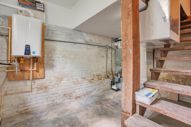 207 W Maxwell St, Lakeland, FL 33803 - unfinished basement with tankless water heater and stairs
