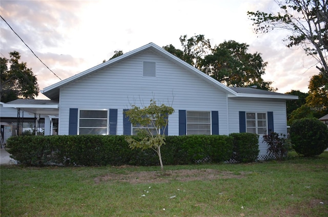 132 Mckean St Unit A, B, Auburndale, FL 33823 - property exterior at dusk featuring a lawn