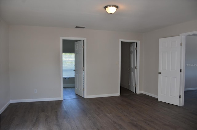 132 Mckean St Unit A, B, Auburndale, FL 33823 - unfurnished bedroom with dark wood-type flooring and baseboards